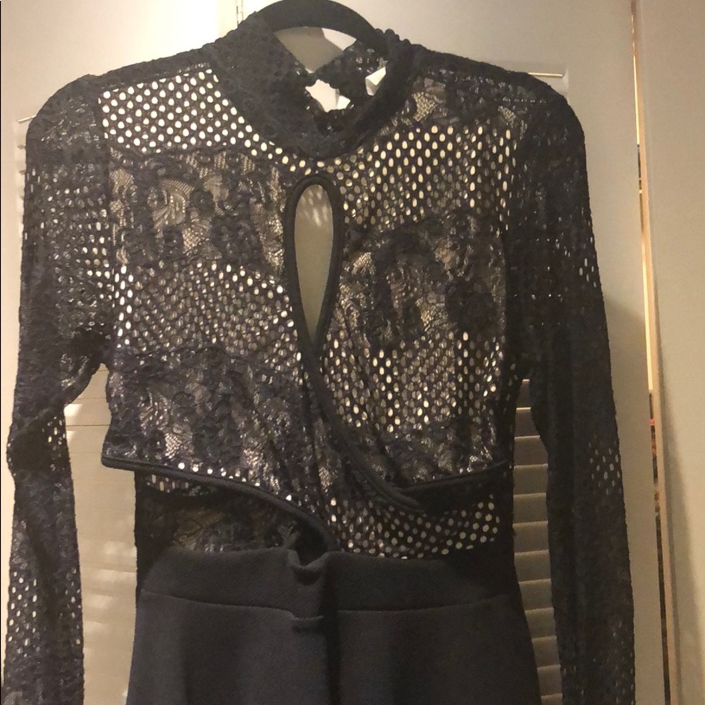 Black lace dress with cutout sides. NWT.